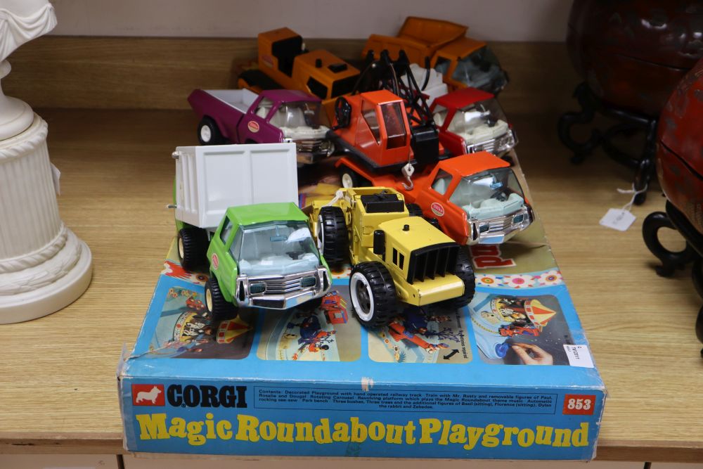 Seven 1970s Tonka diecast vehicles and a Corgi 853 Magic Roundabout Playground set